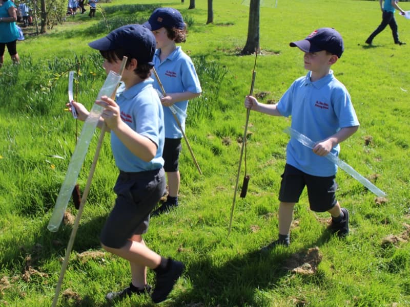 Schoolchildren planting trees with Carbon Footprint Ltd